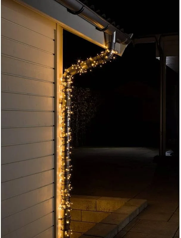 Besuche den Konstsmide-Store Konstsmide Micro LED Lichterkette, 80 bernsteinfarbene Dioden, 24V Außentrafo, schwarzes Kabel - 3611-800 — Weihnachtsbeleuchtung
