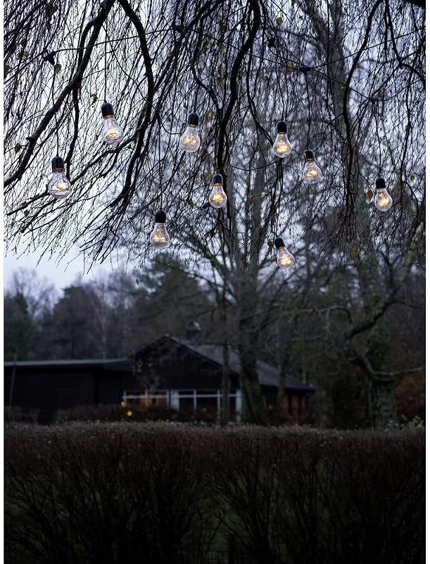 Besuche den Konstsmide-Store Konstsmide LED Biergartenkette Lichtervorhang, 10 klare Birnen, 80 bernsteinfarbene Dioden, 24V Außentrafo, schwarzes Kabel - 2383-800 — Weihnachtsbeleuchtung